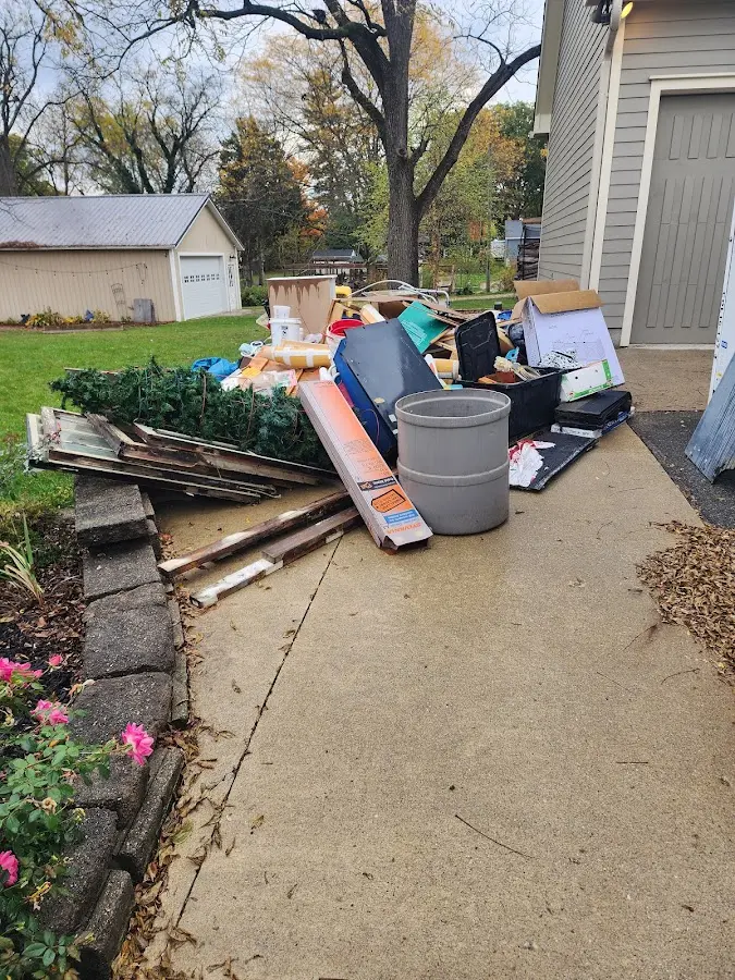 Dumpster being loaded with debris for Residential Dumpster Rental in Schodack
